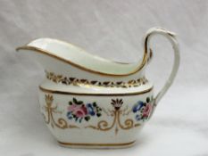 A Swansea porcelain cream jug, painted with roses and gilt swags and a scrolling handle,