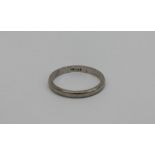 A platinum wedding band, approximately 3 grams,