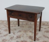 An 18th century oak side table,