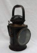 A GWR signal box lamp with an arced handle, with a hinged glazed door, burner and reflector, No.