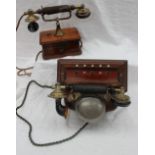 An early 20th century mahogany telephone, the bakelite and brass handset,