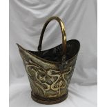 An Art Nouveau stamped brass coal scuttle, embossed with stylised flower heads and tendrils,