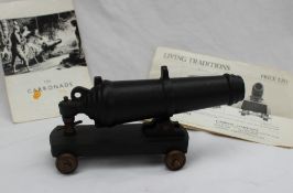 A Carron Company "Carronade" model cannon, on a metal base and brass wheels,