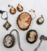 A shell cameo brooch depicting a maiden in profile to a 9ct yellow gold mount and setting together