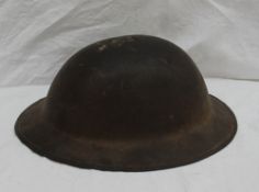 A World War II tin helmet,