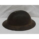 A World War II tin helmet,