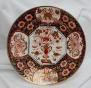 A Swansea porcelain plate decorated in the Japan pattern with central vase of flowers to a vignette