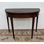 A 19th century mahogany card table,