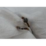 A diamond cluster ring set with a round old cut diamond approximately 0.