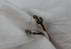 A diamond cluster ring set with a round old cut diamond approximately 0.