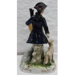 A Continental porcelain figure of a piper with a dog and sheep at his feet on a circular base,