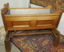 ****Unfortunately this lot has been withdran**** A Swiss pine cradle, with penwork decorated panels,