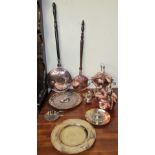 A copper spirit kettle on a stand together with another copper kettle, copper bed warming pans,
