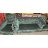 A Victorian upholstered three piece suite including a chesterfield settee together with a pair of
