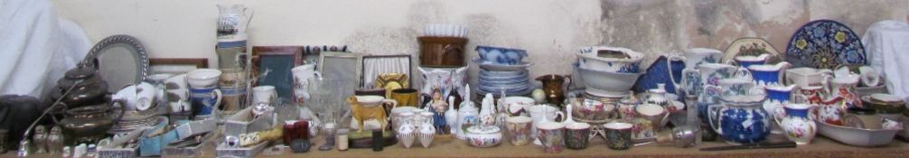 A large lot including Guinness ashtrays, Royal Vale part teasets, photograph frames,