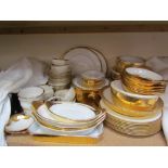 A Royal Worcester gilt decorated part dinner set together with a Royal Doulton gilt decorated part