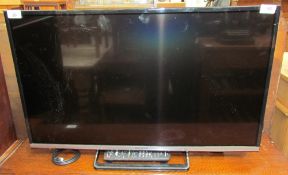 A Panasonic 32" flat screen television and remote control, (Sold as seen,