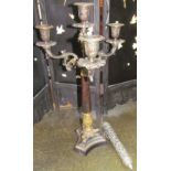 A bronze candelabra together with a white metal pierced container