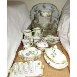 An Herend floral and butterfly decorated part tea and dinner set CONDITION REPORT: