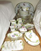 An Herend floral and butterfly decorated part tea and dinner set CONDITION REPORT: