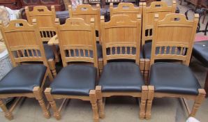 A set of eight light oak and leather upholstered dining chairs