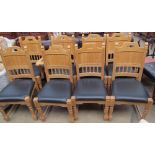 A set of eight light oak and leather upholstered dining chairs