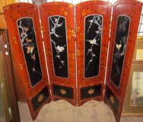 A four-fold lacquer screen inland with mother of pearl decorated with birds amongst trees together