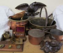 A brass letter scales together with weights, copper and brass cooking pots, carved oak eagle,