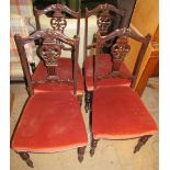 A set of four Edwardian carved and upholstered salon chairs