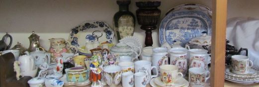 A large lot including a blue and white meat plate and commemorative jugs together with motto wares,