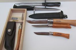 Four Opinel knives together with two bayonets CONDITION REPORT: Will only be sold to