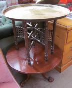 A mahogany occasional table with a tripod base and ball and claw feet,