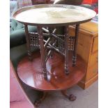 A mahogany occasional table with a tripod base and ball and claw feet,