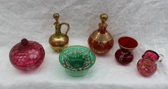 A ruby glass scent bottle with gilt jewelled decoration together with another scent bottle,
