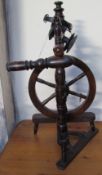 A small fruitwood spinning wheel