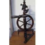 A small fruitwood spinning wheel