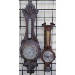 A 20th century oak aneroid barometer together with another barometer