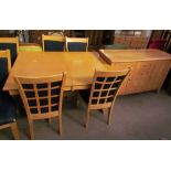 A modern dining room suite comprising an extending dining table,