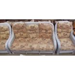 A wicker upholstered five piece suite, comprising a three seater,