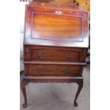 A reproduction mahogany bureau