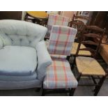A 19th century upholstered arm chair together with a pair of ladder back bedroom chairs,