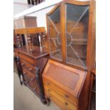 A 20th century oak bureau bookcase together with a Victorian mahogany chest of drawers,
