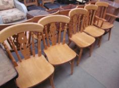A set of ten modern dining chairs with turned legs,