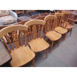 A set of ten modern dining chairs with turned legs,