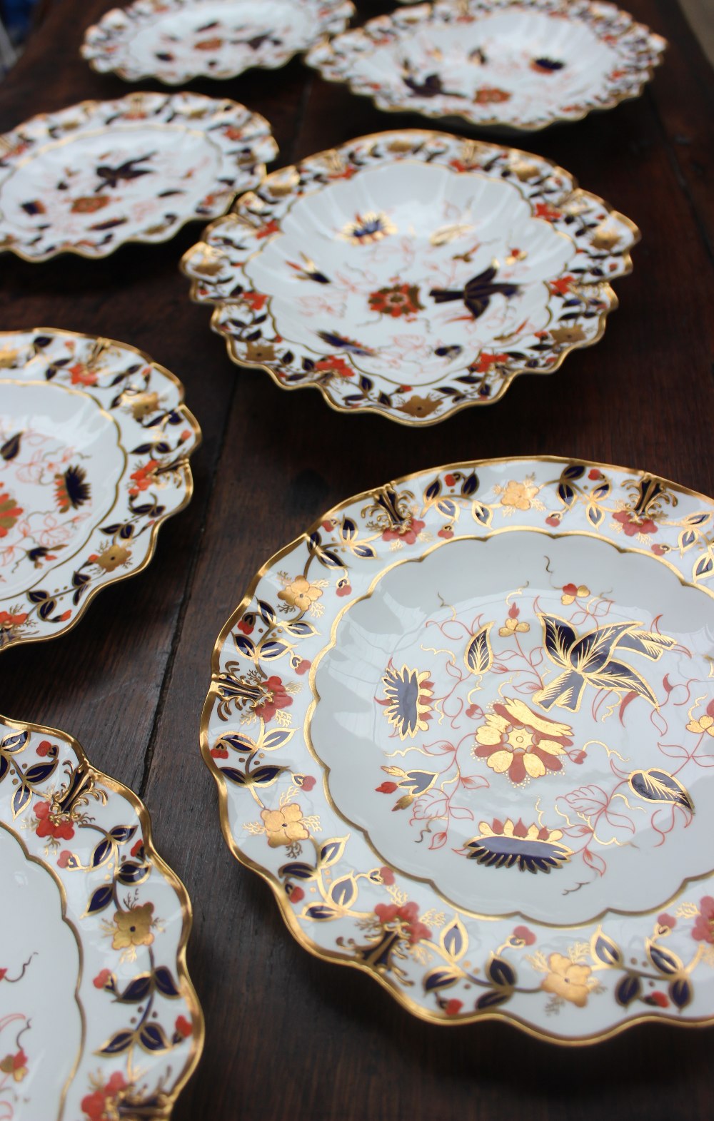 A Royal Crown Derby part dessert set, 3714 pattern, comprising six flared circular plates, - Image 6 of 6