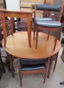 A teak extending dining table and six chairs, possibly Mackintosh,