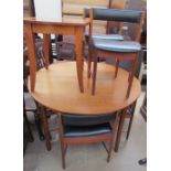 A teak extending dining table and six chairs, possibly Mackintosh,