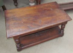 A 20th century oak coffee table with a rectangular top on turned legs and an undertier