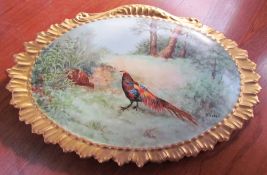 Limoges porcelain plaque decorated with a pheasant and hen in a landscape,