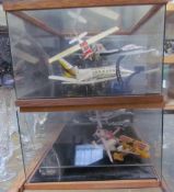 Two display cabinets containing model aeroplanes CONDITION REPORT: Airfix type